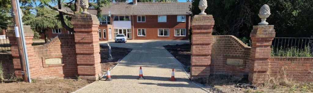 This is a photo of a newly installed chip and tar driveway, installed by Fulbourn Driveways